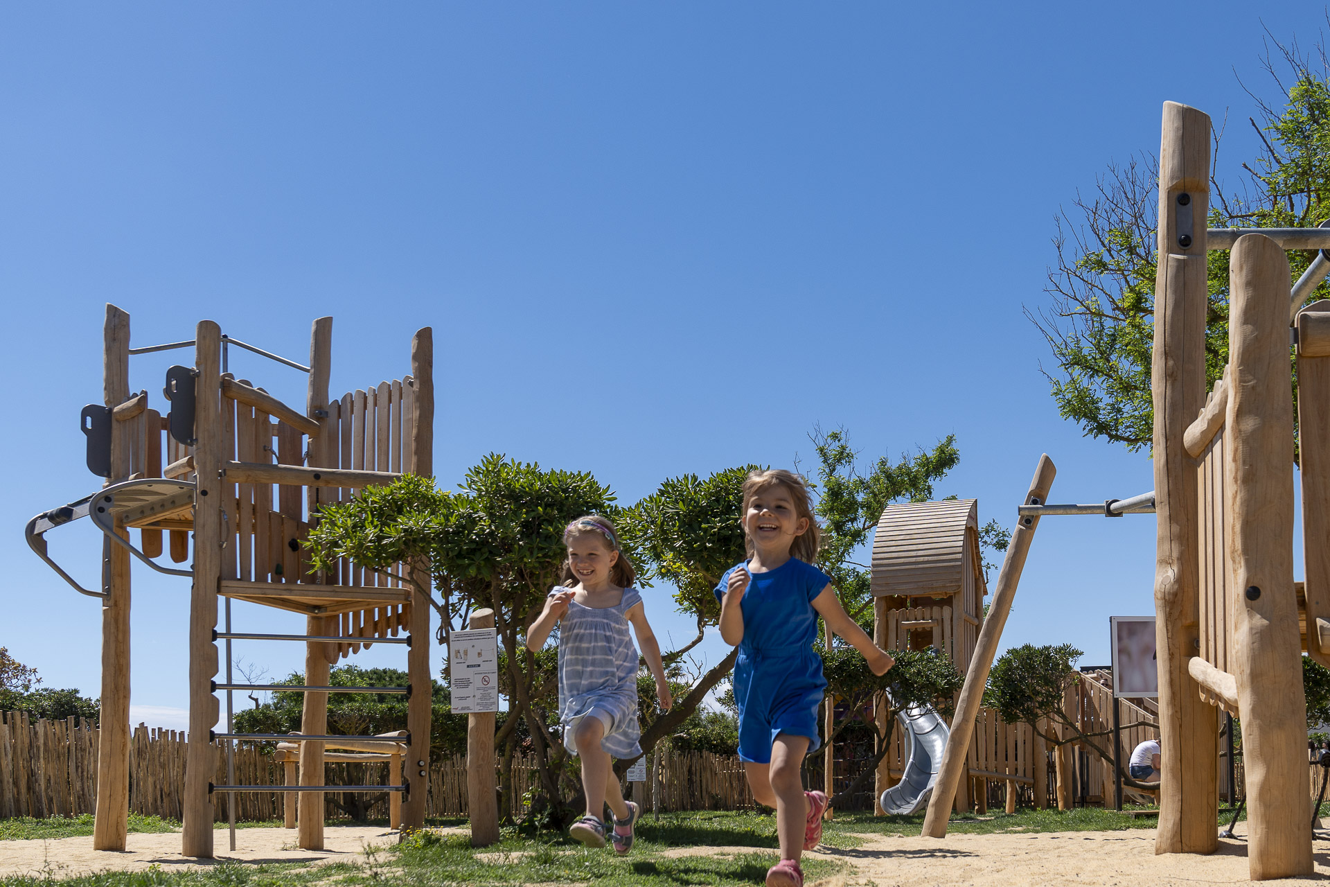 Le Brasilia campsite, children&rsquo;s club, parents, child and an activity leader